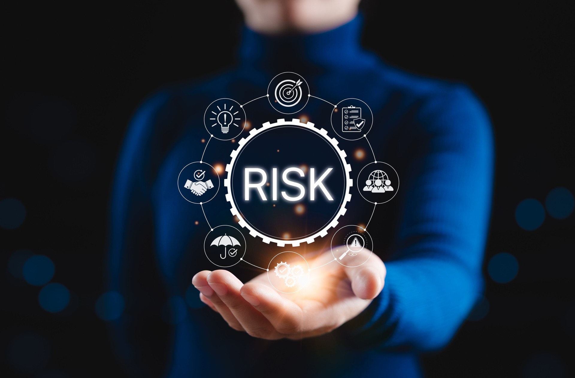 Risk Management and Assessment Concept. Businessperson presenting with icons related to risk management, assessment, strategy, compliance, operational, and mitigation in modern business context.